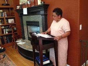 Faith Adiele reading in the home of Susan Ito. 